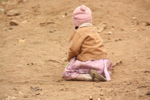 A baby girl plays at the Pipeline camp for the internally displaced persons in Nakuru where a court has sentenced a 44 year old man to 75 years in prison for committing an indecent act on his daughter (not this one) predisposing her to HIV infection.