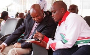 Director of Digital Media and Diaspora Communication Dennis Itumbi (right) shows Nakuru County Governor Kinuthia Mbugua the basics of Wi-Fi connectivity. Photo Courtesy of Nation Media