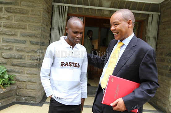 The standard Deputy News Editor and Nakuru Bureau chief Alex Kiprotich (left) and his lawyer Juma Kiplenge. Photo courtesy of The Standard