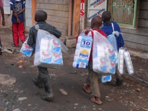 Young children hawking tissue papers in the estates.
