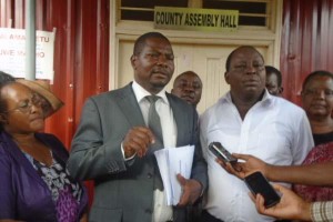 Tharaka Nithi finance executive Mate Murithi (Left) and County assembly Budget and appropriation Committee chairman Karani Laban in white shirt. Photo courtesy of www.the-star.co.ke