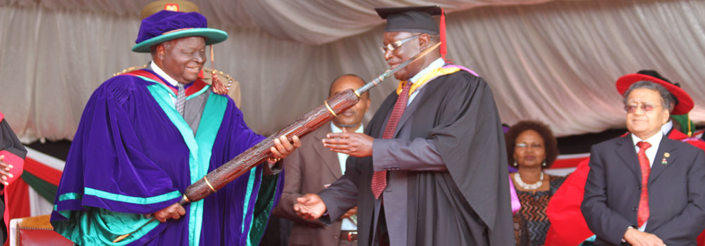 Former President Mwai Kibaki formally awarding Technical University of Kenya (TUK) its Mace, symbolizing the charter. Photo courtesy of www.tukenya.ac.ke